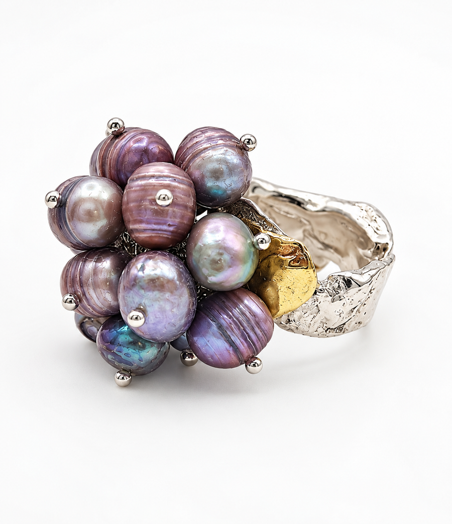 Statement ring with iridescent purple and blue freshwater pearl clusters set on a silver-tone band.