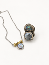 Silver coin pearl necklace with a blue-toned coin pendant and matching earrings
