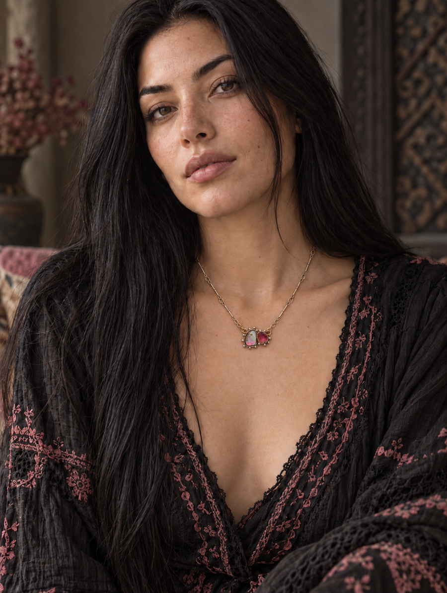 Pink tourmaline opal necklace worn by a model, showcasing its colorful gemstone pendant